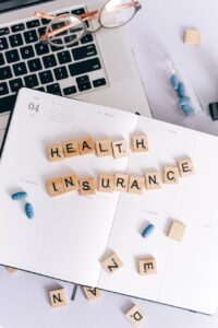health insurance scrabble tiles on planner